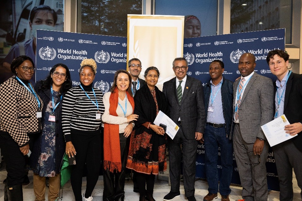 Representatives from the HQ and Country teams that worked on the winning Self-Care Wheel with Dr Tedros Gebreyesos, Director General of WHO.